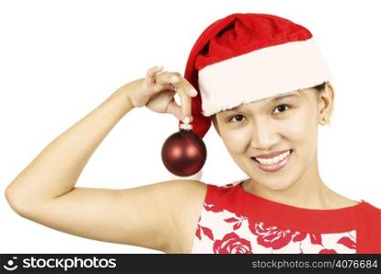 A pretty woman holding a christmas ornament