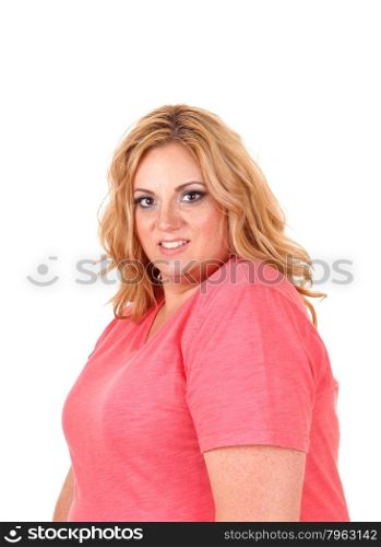 A pretty woman in a pink sweater looking into the cameraa portrait, isolated for white background.