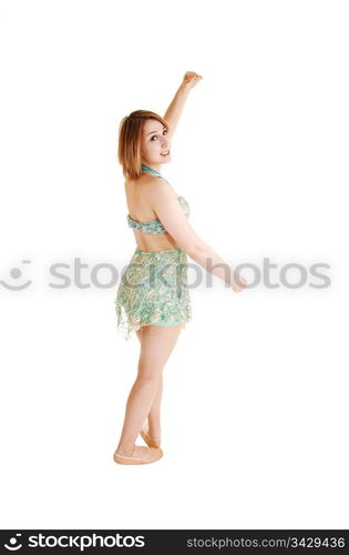 A pretty young ballet girl standing in the studio, praxis her dancing, ina nice green dress, for white background.