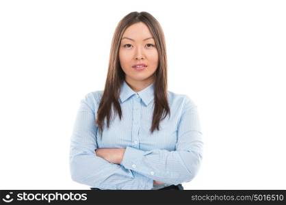 A pretty young businesswoman standing on a white background with hands folded