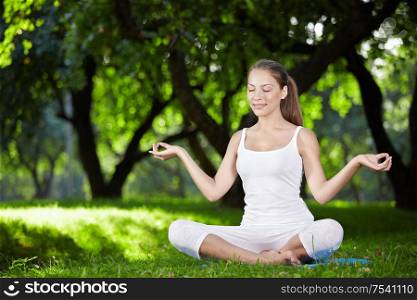 A pretty young girl in lotus position