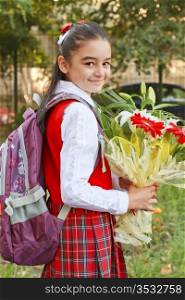 A pretty young girl on her way to school