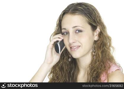 A pretty young teenager talks on the phone