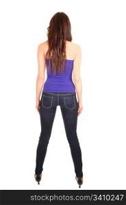 A pretty young woman in jeans and a strapless top standing from the back in the studio for white background.