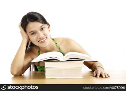A pretty young woman sitting with an opened book