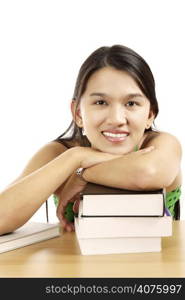 A pretty young woman with a stack of books