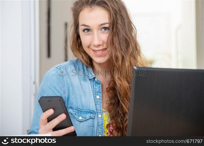 a pretty young woman with long hairs using smartphone