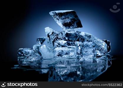 A professionally formed piece of ice on reflecting surface.