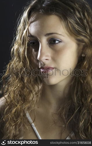 A profile shot of a demure and attractive young model