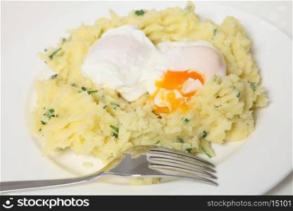 A quick and economical meal of poached eggs in a nest of mashed parsley potatoes