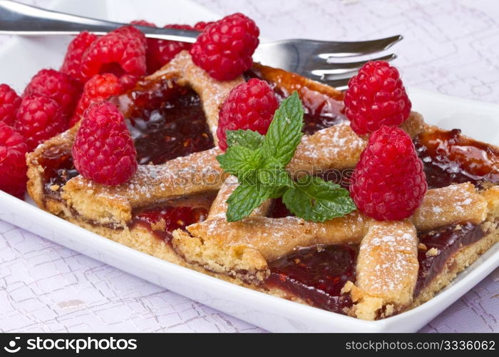 a raspberries tart with fresh fruits