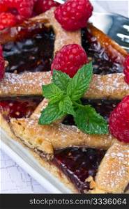 a raspberries tart with fresh fruits
