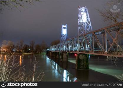 A recently finished bridge deck allows pedestrians to venture out over the Willamette River in Salem