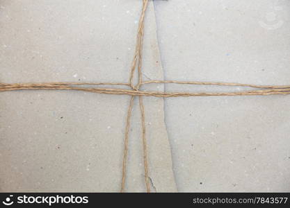 A recycle knot wrapping on gray packing paper background