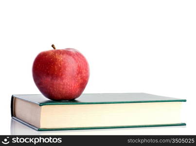 A red apple red on a green paper on a white background