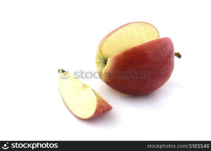 A red apple that has a slice cut out