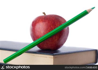 A red apple with green pencil on top of many books on a white background