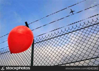 A red balloon in danger
