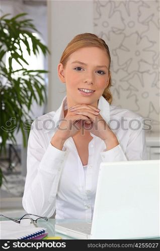 a red head woman doing computer