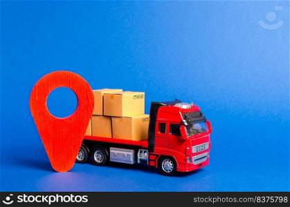 A red truck loaded with boxes and a red pointer location. Services transportation of goods, products, logistics and infrastructure. Transportation company. Location of carriers. Package tracking