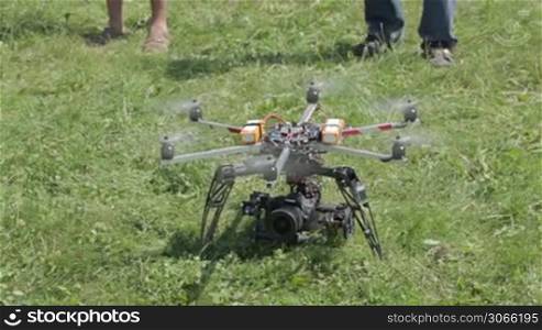A remote controlled flying craft. Helicopter for aerial photo and video is preparing for take off.