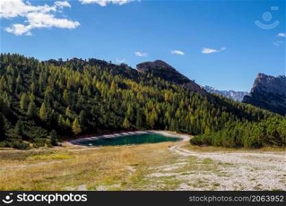 A reservoir for artificial snow production. Belluno Province, Dolomiti Alps, Italy