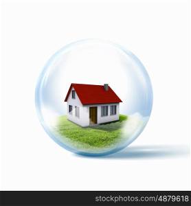 A residential house with red roof. A residential house with red roof inside a glass sphere