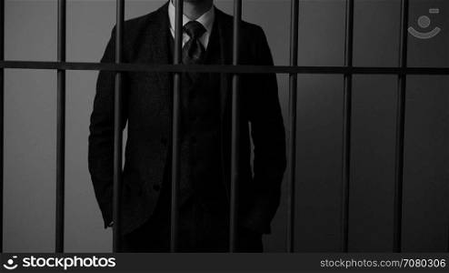 A rich criminal behind bars in prison