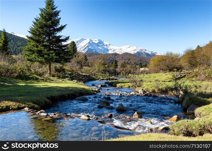 a river with Pic du Midi de Bigorre in the french Pyrenees