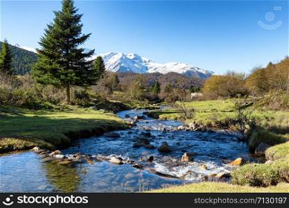 a river with Pic du Midi de Bigorre in the french Pyrenees