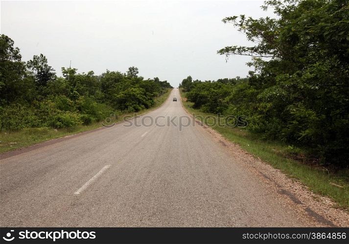 a road near the town of Savannakhet in central Lao in the region of Khammuan in Lao in Souteastasia.. ASIA LAO KHAMMUAN REGION