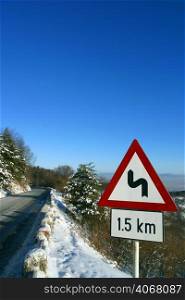 A road through the Snowy forest, Brasov, Transylvania, Romania.