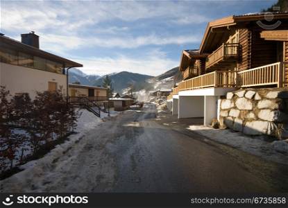 A road winding through an Austrian ski resort