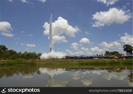 a rocket start at the traditonal rocket festival or Bun Bang Fai in Ban Si Than in the Provinz Amnat Charoen in the northwest of Ubon Ratchathani in the Region of Isan in Northeast Thailand in Thailand.&#xA;