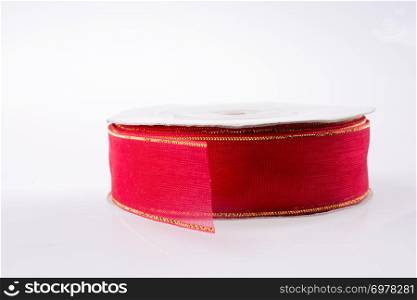 A roll of red ribbon, isolated on white