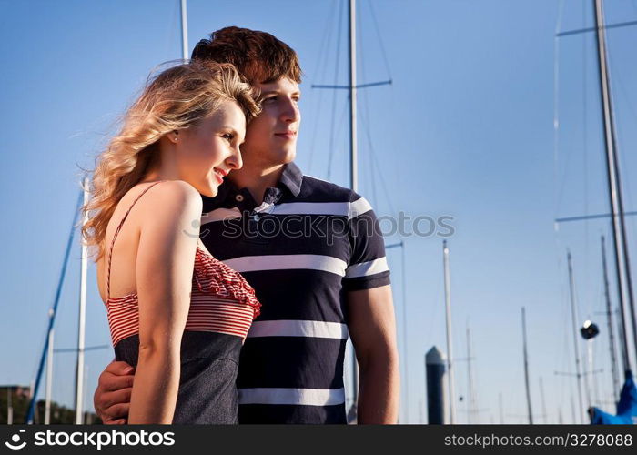 A romantic caucasian couple in love at the marina outdoor