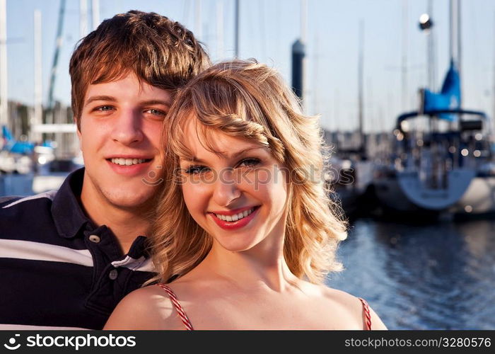 A romantic caucasian couple in love at the marina outdoor