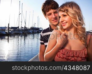 A romantic caucasian couple in love at the marina outdoor