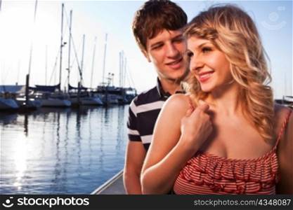 A romantic caucasian couple in love at the marina outdoor