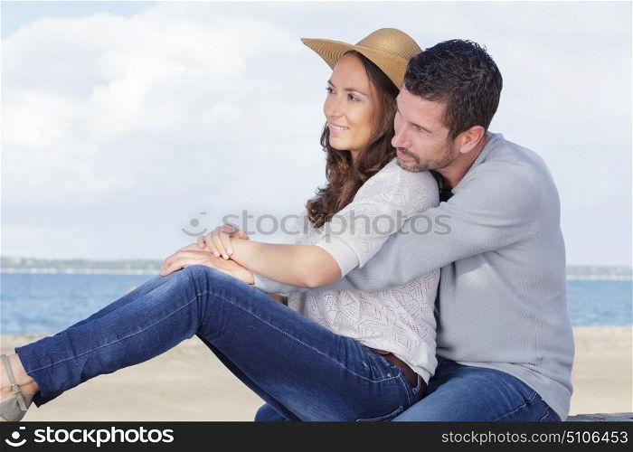 a romantic couple is outdoors