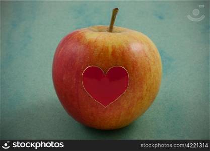 A rosy apple with a Valentine heart