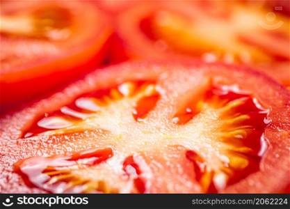 A round piece of tomato. Macro background. Tomato texture. High quality photo. A round piece of tomato. Macro background.