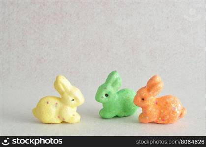 A row of colorful bunnies used for decoration over the easter period isolated on a white background