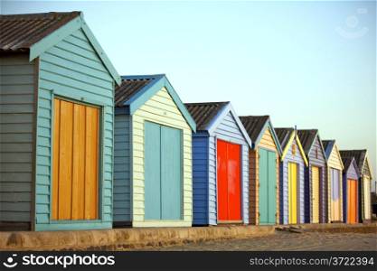 A row of Colourful Houses at the Beach. Bright Painted Houses