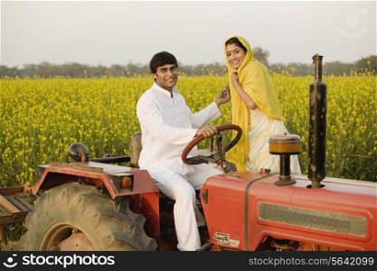 A rural couple on a tractor