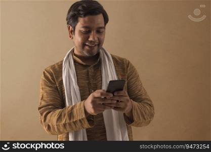 A RURAL MAN HAPPILY USING MOBILE PHONE