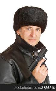 A russian mafia figure with a large facial scar carrying a hand gun