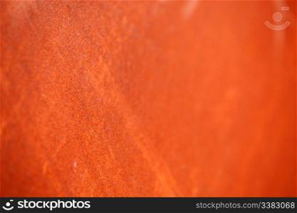 A rust background texture with very shallow depth of field