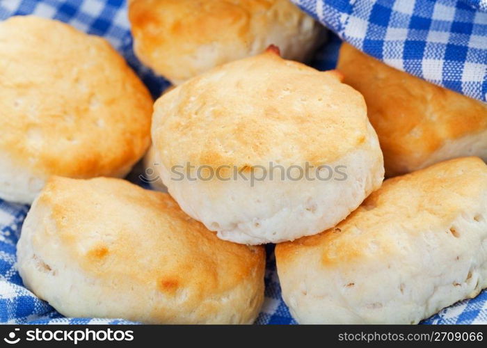 A rustic, country chic basket of freshly baked buttermilk biscuits. Shallow dof.