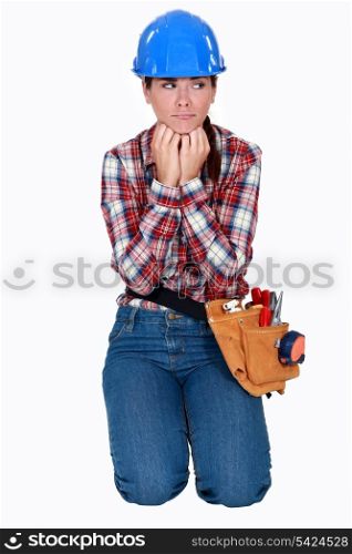 A sad female construction worker.